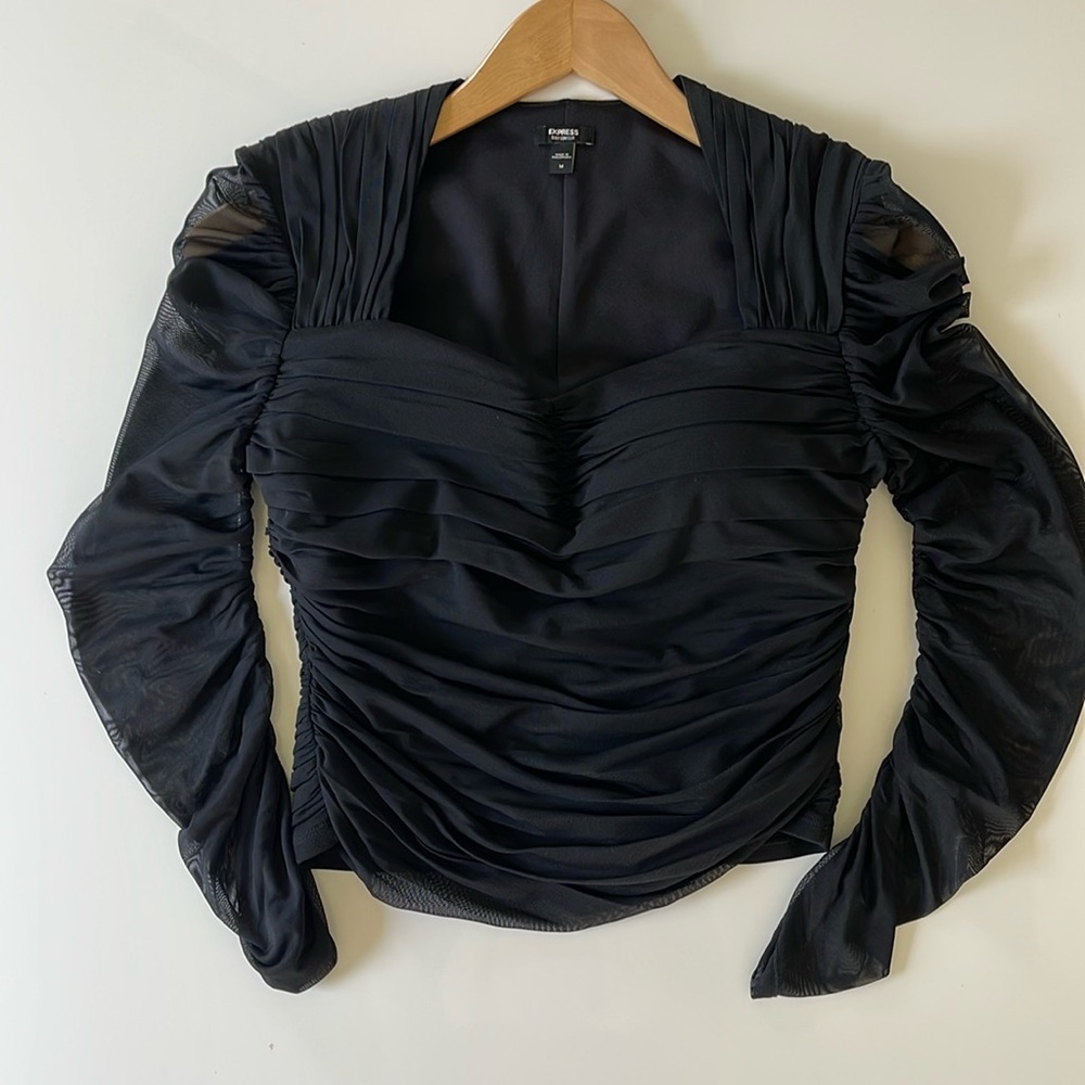 Express. Brand new. Never worn. Black ruched sweetheart top